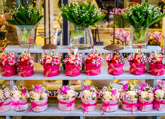 Beautiful flower display with vibrant arrangements in a floral shop showcasing colorful bouquets and decorative pots