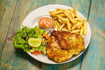 Grilled chicken fillet with french fried potato