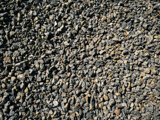 Gravel surface with textured gray stones