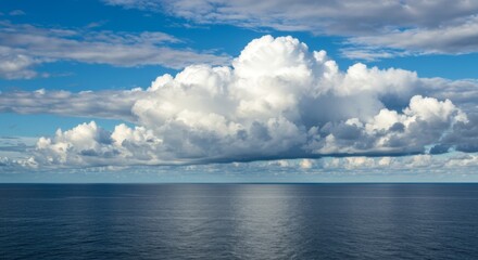 Obraz premium Vast Cumulus Clouds Over a Tranquil Ocean