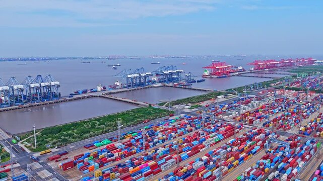 4K Real Time Aerial view of Industrial port with containers in Shanghai Waigaoqiao container Port Area.