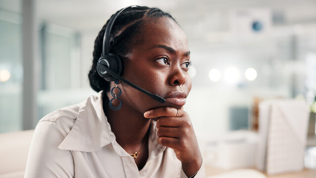 Black woman, consultant and worry with headset at call center for error or difficult customer. Female person, agent or employee with mic for virtual assistance, help or communication at office desk