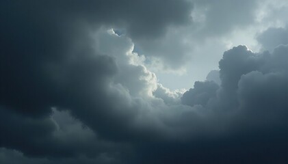 Brooding, charcoal-grey clouds swirl, pregnant with tempest , tempestuous, cloudscape