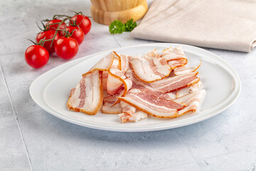 Raw pork tenferloin with bacon