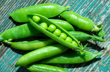 Fresh pods of green peas close-up.