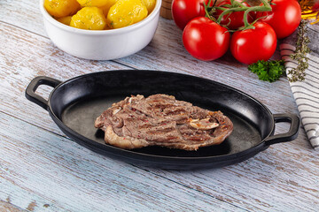 Grilled lamb steak with bone