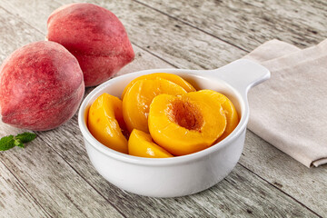Sweet ripe yellow canned peaches