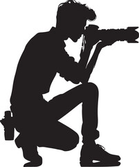 Naklejka premium A focused photographer in a crouched position, capturing a moment with a DSLR camera.