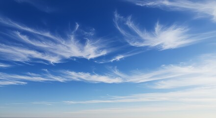 Azure sky, wispy cirrus clouds. Serene, celestial, airy. Nature's abstract artwork.