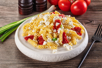Italian pasta fusili with curd