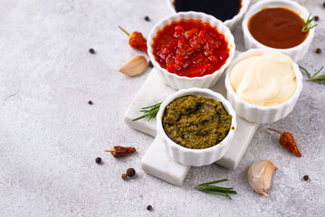 Set of different sauces. Ketchup, mustard, pesto