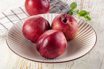 Ripe sweet juicy nectarines heap