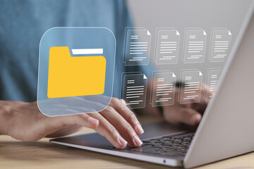 Document management system technology concept. File storage process. Person using laptop to store...