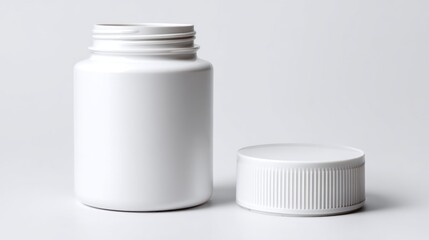 Empty white plastic pill bottle with open lid