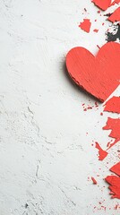 Red wooden heart on textured surface