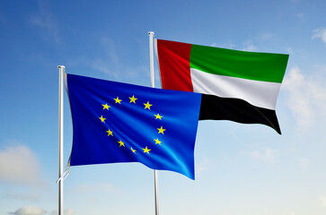 flags of emirats arabes unis and european union over blue sky background.