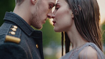 close, intimate moment between two young lovers standing face to face under soft falling rain. Droplets cling to their skin and hair. Their foreheads nearly touch, lips parted in silence 