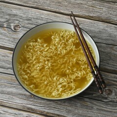 Oriental instant noodles, curry flavour with chives.