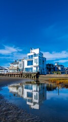 Waterfront property with a kitchen captured in clear blue sky, showing modern architecture, detailed textures, and clean surroundings.