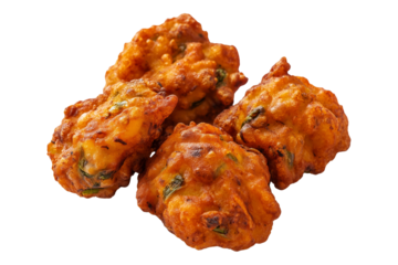 Crispy golden vegetable Indian fritters Pakoras with herbs, isolated on white transparent background, concept of traditional snack