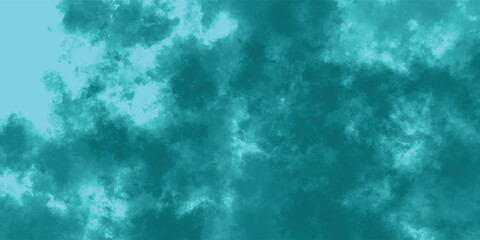 Wispy Turquoise Storm Clouds Spreading Gracefully Over a Celestial Blue Canvas

