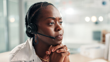 Black woman, consultant or concern with headset at call center for bad news or difficult customer. Female person, agent or employee thinking with mic in worry for negative feedback or error at office