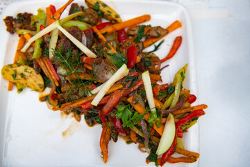Different vegetables are beautifully served on a white plate