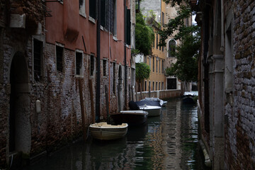 Charming Venetian Canal Scene with Boats and Old Architecture