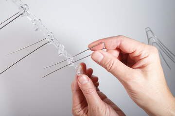 Bird deterrent spike section with thin metal rods mounted on transparent plastic base. Designed to...
