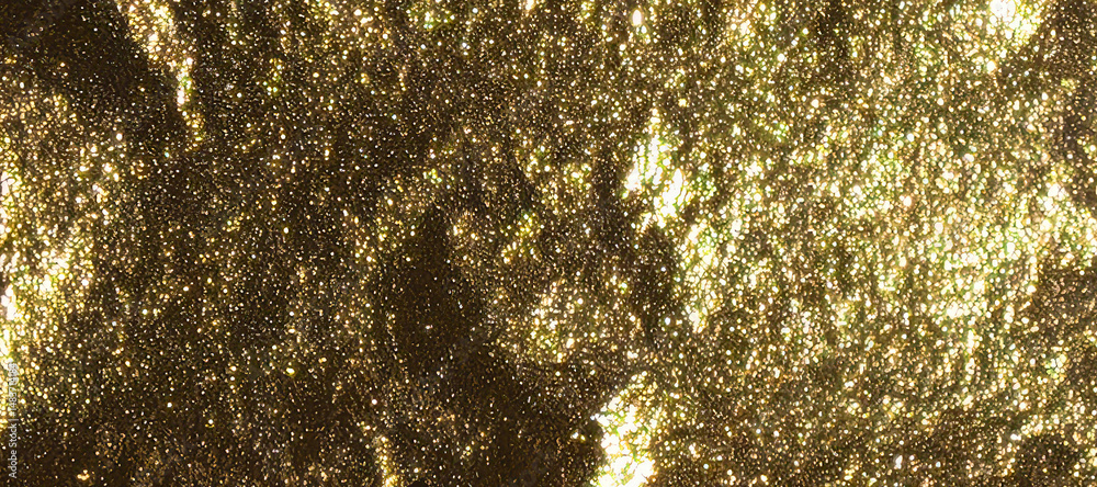 Poster a luxurious golden glitter background with a shiny, sparkling effect. the shimmering texture of