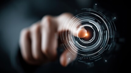 Finger touching a glowing circular interface with abstract digital elements on dark background.