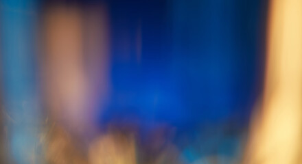 Abstract light leaks on black background with copy space. Studio lens flare bokeh effect.