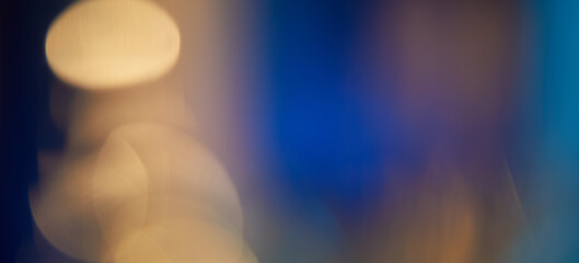 Abstract light leaks on black background with copy space. Studio lens flare bokeh effect.