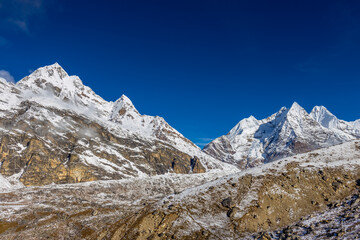 Mera Peak high altitude mountain summit ascent in Himalayas. Stunning views above the clouds at sunrise from the top of the mountain. Alpine route climbing on the snow path in Himalayas