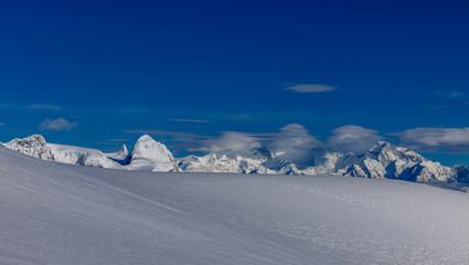 Mera Peak high altitude mountain summit ascent in Himalayas. Stunning views above the clouds at sunrise from the top of the mountain. Alpine route climbing on the snow path in Himalayas