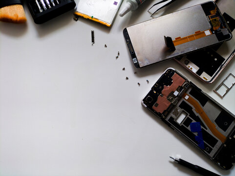 repair of a mobile phone on white background