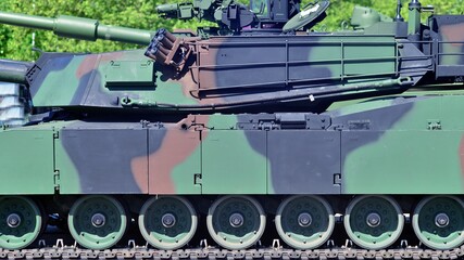 Caterpillar of a modern tank. Undercarriage with tracks and slides of military.