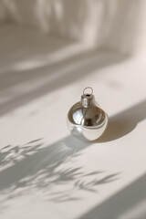 solitary christmas ornament resting on pristine white surface essence of holiday nostalgia