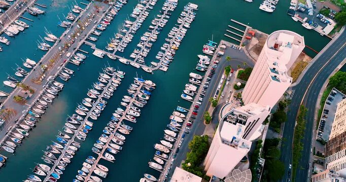 Seaport with piers and moored yachts and boats. Ala Wai Port in Honolulu. Aerial view from above of the harbor.