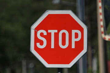 Red stop sign on a blurred background. Red traffic stop sign 