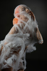 Captivating red-haired woman ensnared in delicate net trap