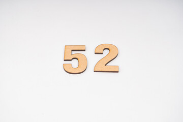 Number fifty-two on paper on white background