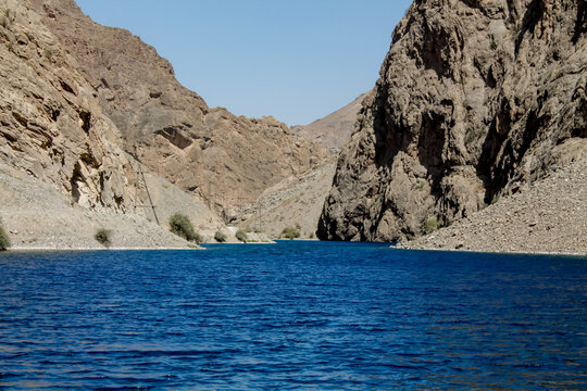 Fann mountains in Pamir Alay, Tajikistan. Dry desert mountain landscape in Middle Asia, lake and trees. Tajikistan Fann mountains lake panorama landscape. Allo, Alauddin and Kulikalon lake in Fans
