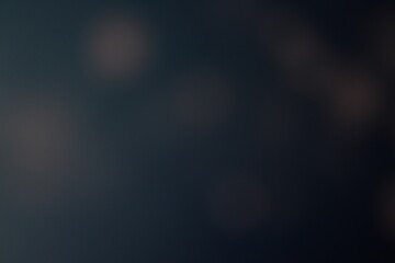 Christmas lights in bokeh. Outside in December. Snow and blue bokeh on a black background, bokeh abstract background, modern technological abstract background. Blue Christmas background, Xmas bokeh 
