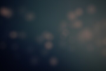 Christmas lights in bokeh. Outside in December. Snow and blue bokeh on a black background, bokeh abstract background, modern technological abstract background. Blue Christmas background, Xmas bokeh 
