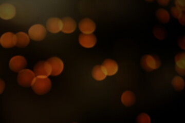 Red and fire orange bokeh on a black background, bokeh abstract background, modern abstract backdrop. Orange Christmas background, Xmas backdrop. Halloween scary concept, Halloween bokeh background   © TomKorcak