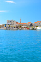Budva, Montenegro - May 04, 2024: Dukley Marina and Old Town. The old city walls of Budva along the Adriatic coast, Montenegro. On a hot, sunny, spring afternoon.