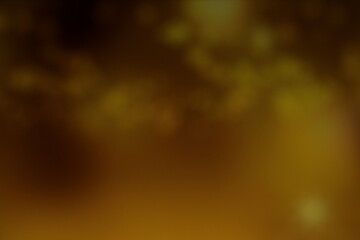 Christmas lights in bokeh. Outside in December. Golden bokeh on a black background, bokeh abstract background, modern technological abstract background. Gold Christmas background, Golden particles 