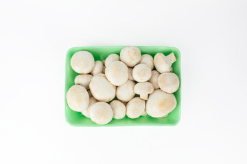 mushrooms on white background, packaged mushrooms