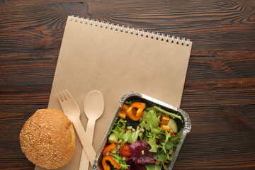 Healthy meal slimming diet plan daily ready menu background, organic fresh dishes and smoothie, fork knife on paper eco bag as food delivery courier service at home in office concept, close up view.